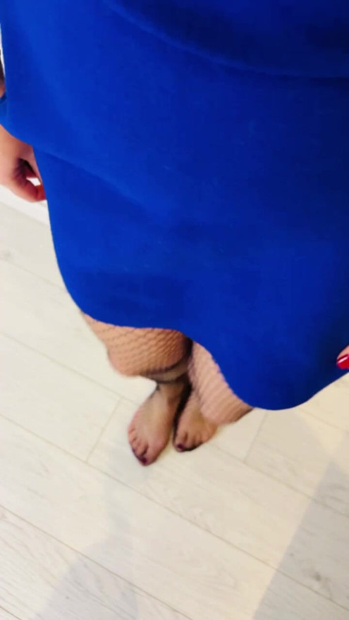 Redhead irish ginger showing her legs in skirt and fishnets