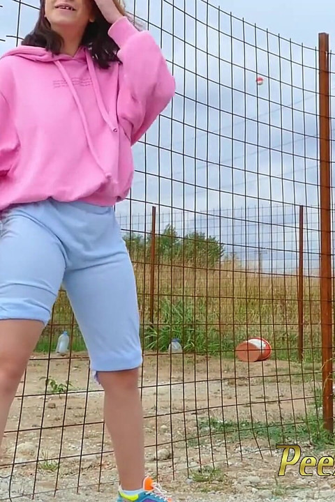 Desperate hipster girl trying hard to pee