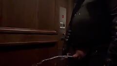 demon having a nice long piss in an elevator