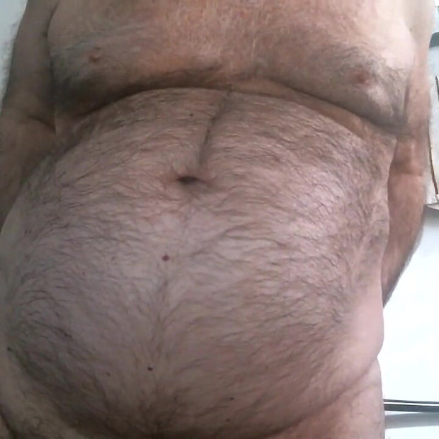 Coach Karl Shows off His Furry Belly