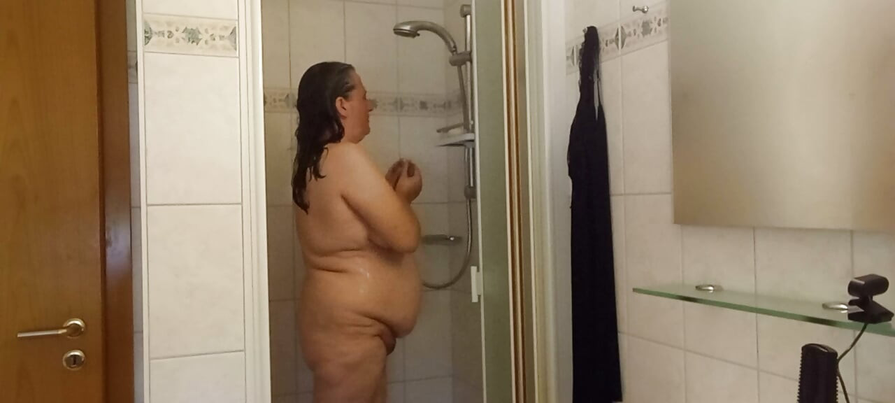 Chubby mature woman in the shower - soft belly - part 2