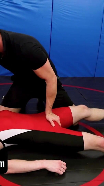 Captivating moment from "Varsity Grip - Hunk Coach Brian Bonds Drills Young Twink Wrestler In Spandex After Practice"