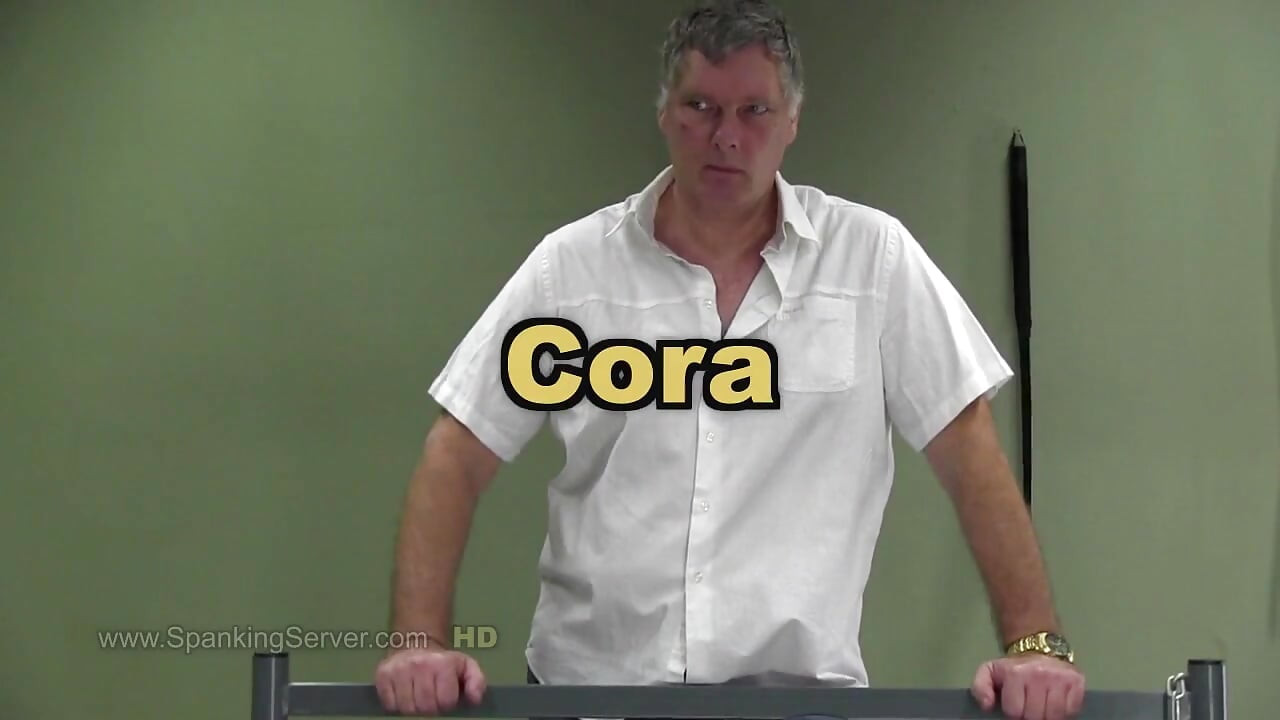 Cora ass whip in a predicament bondage position
