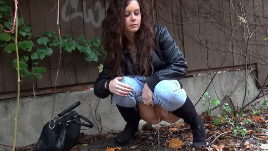 Shy Brunette Tries Public Pissing