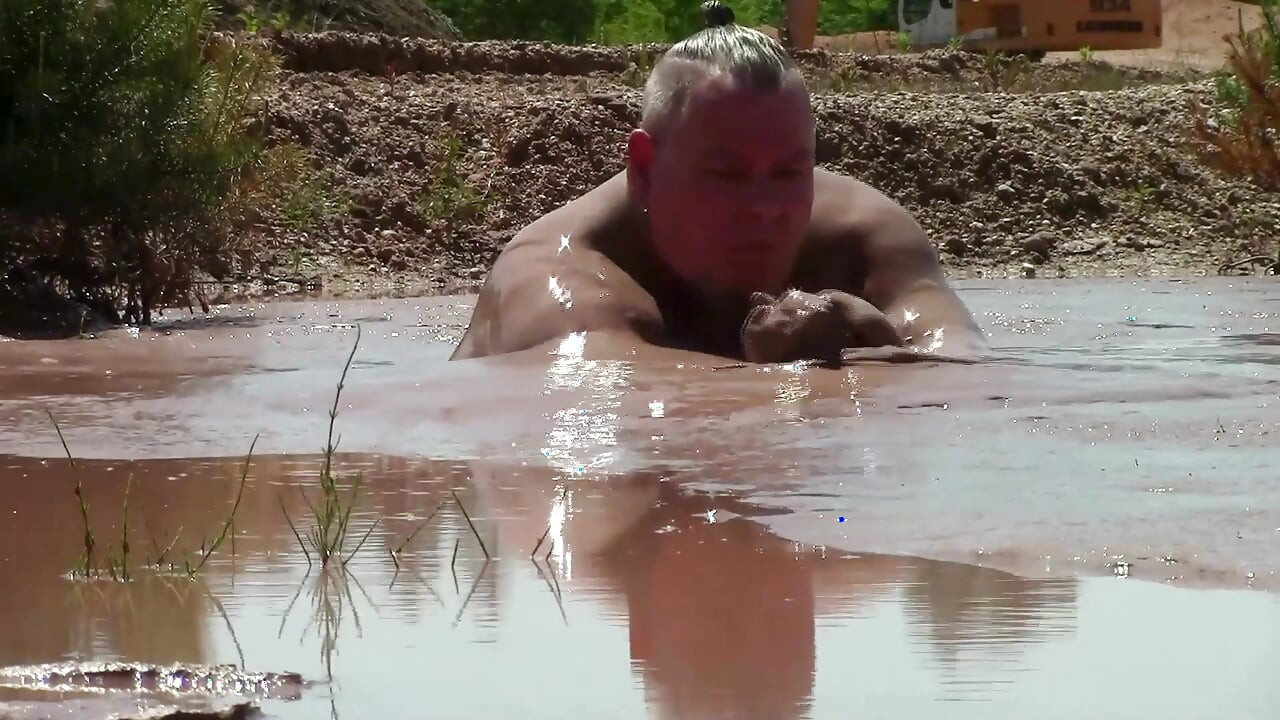 Deep, Creamy Brown Mud Bath in a Sand Pit