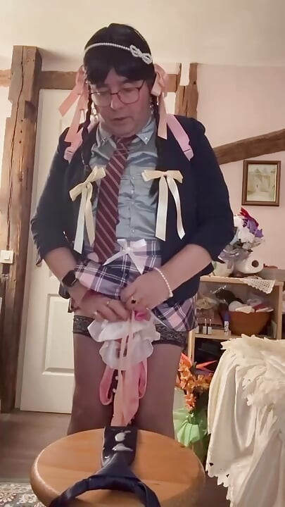 In a schoolgirl outfit to cum on the navy blue tie