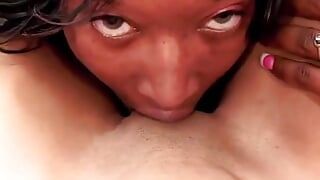 Hungry ebony licks her girlfriend's pussy while she is masturbating with a toy