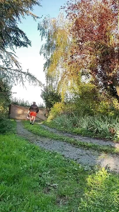 Dressed in a tight-fitting orange dress for a night out