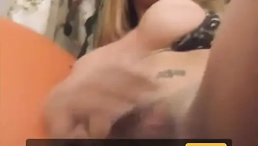 Busty blonde tranny babe strokes her hard cock on the chair