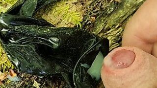 Outdoor cumshot in a used condom in the forest