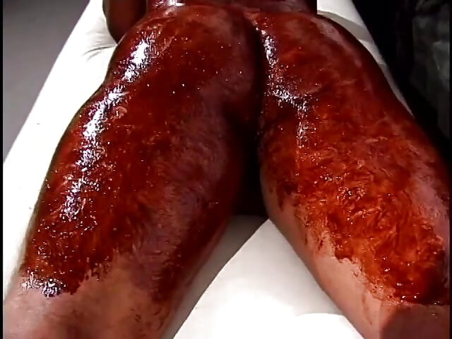 Randy masseur spreads chocolate all over gay hunk's tight ass