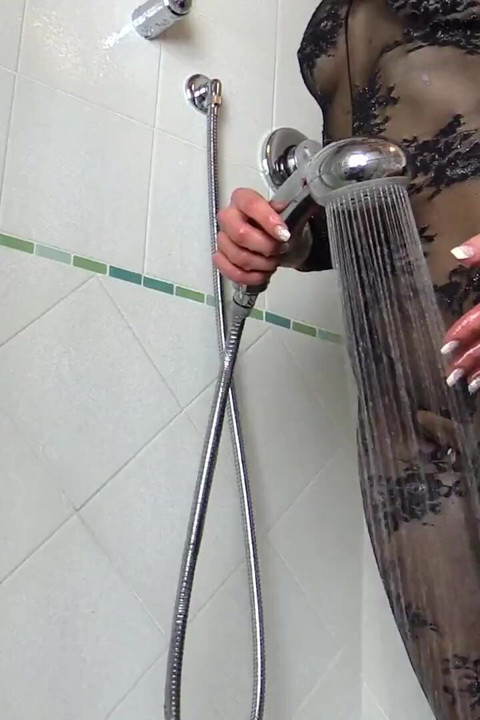 Blonde Monique in pantyhose taking a shower