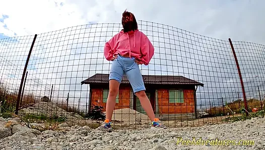 Hipster girl pee in her jeans - changing her wet shorts into dry pants