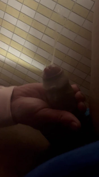 Under-stall bathroom handjob and cum shot