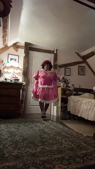 Dressed in a pink maid outfit for the day