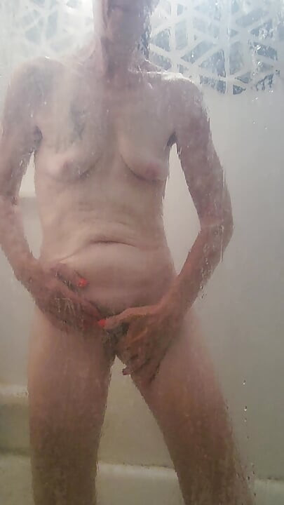 Hot, Sexy, Mature Goode Girl in the shower soaping her body and fingering her pussy
