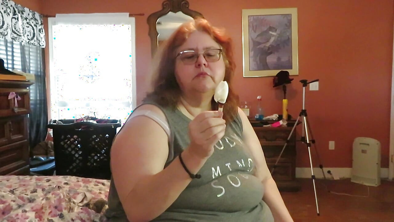 BBW nurse Vicki enjoys eatting a chocolate vanilla ice cream popsiscle
