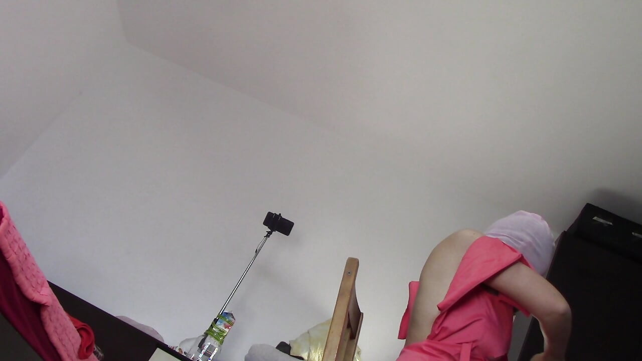 Amateur wife dancing naked at home. Amateur woman has fun trying on clothes and cutting them.