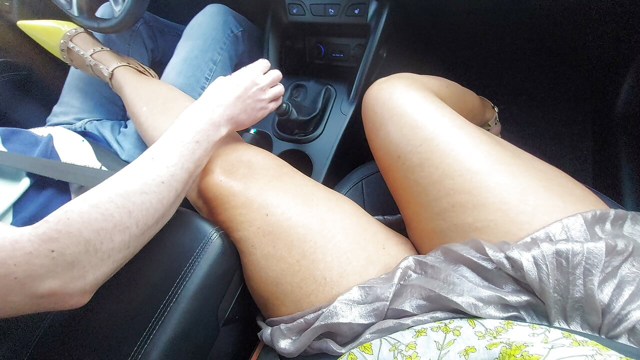 An elegant mature lady with beautiful legs in high heels seduces a taxi driver in the morning