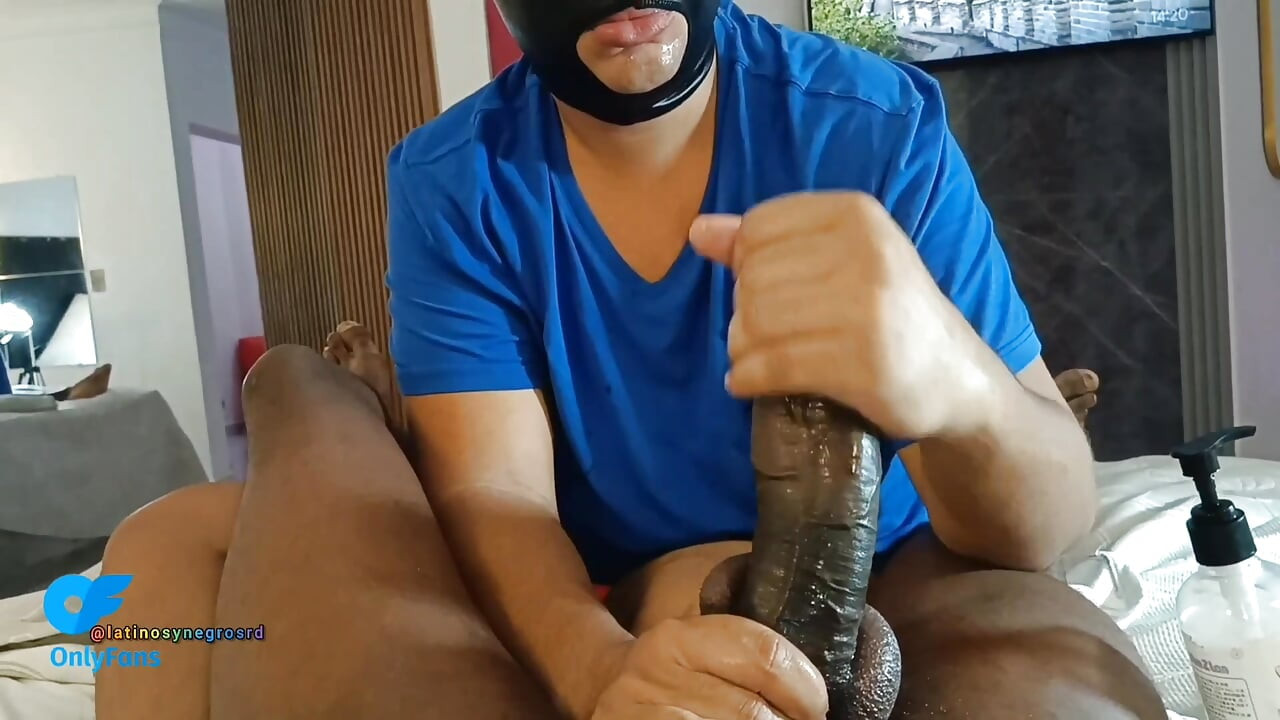 I lie on my neighbor's belly and suck his huge thick black cock as he comes out of his boxers.