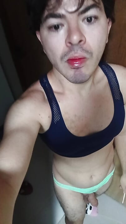 gay femboy sexy skirt lingerie and licking lollipop