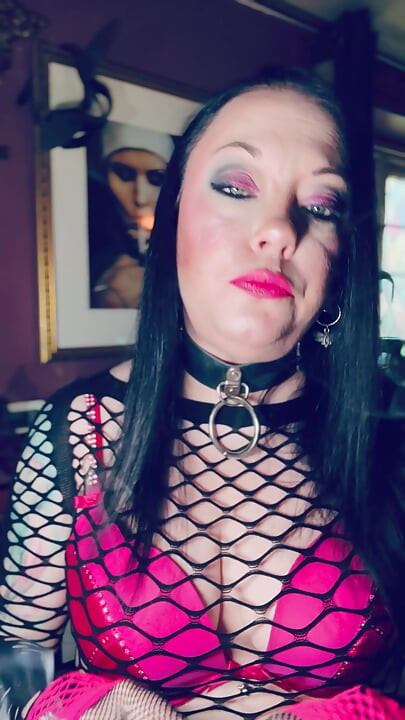 Pink & Delicious Tina Snua Sparks Up A Cigarette In A Holder