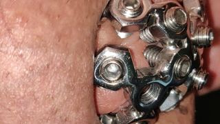 close up of the set screw in my chastity cage