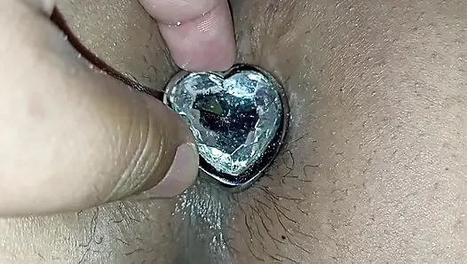 I fuck her ass with an anal plug in her ass and then I put my cock in th...