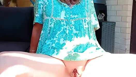 Horny mature in summer dress , boots and no knickers displaying huge meaty gaping cunt