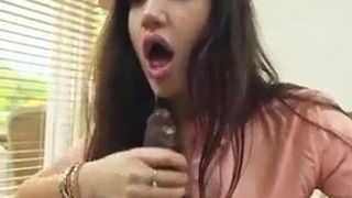 Pretty Brunette gives a sloppy blowjob to a huge black cock