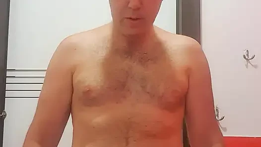 A boy completely naked in a station bathroom