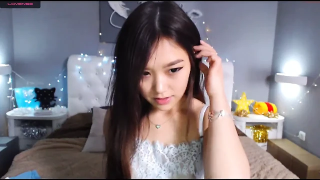 Sweet Japanese webcam model likes to masturbate naked on camera