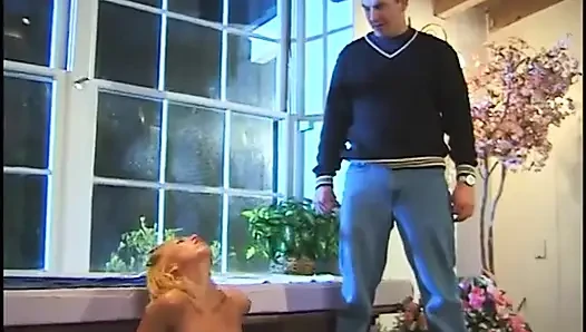 Naked blonde masturbates in hot pool while man with pantyhose on his head watches