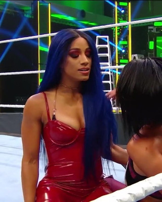 WWE - Sasha Banks in hot red outfit looking out for Bayley