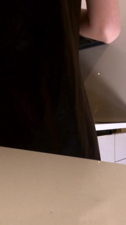 Hot sexy long legs brunette wife in black and red fishnet stockings with a satin nightie teases in the kitchen | Clip 1