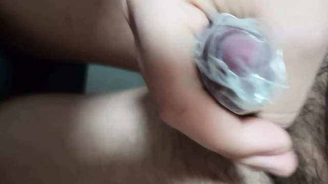 Chinese boy cumming in condom with tight cock ring