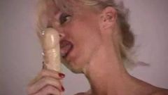 Mature lady with big silicone tits masturbating