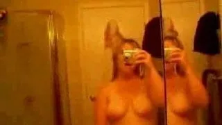 Filming herself in the bathroom