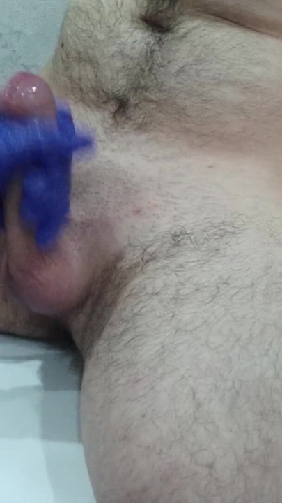 The nurse thoroughly massaged the patient's testicles and penis to collect sperm for analysis. | Clip 3