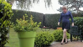 in the garden wearing vintage seamed nylon stockings