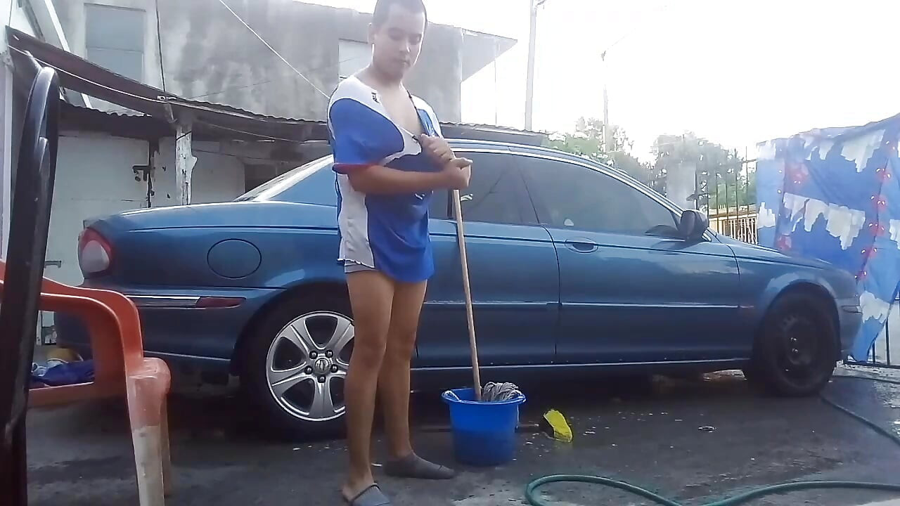 Jesus in gray boxer washing his jaguar car