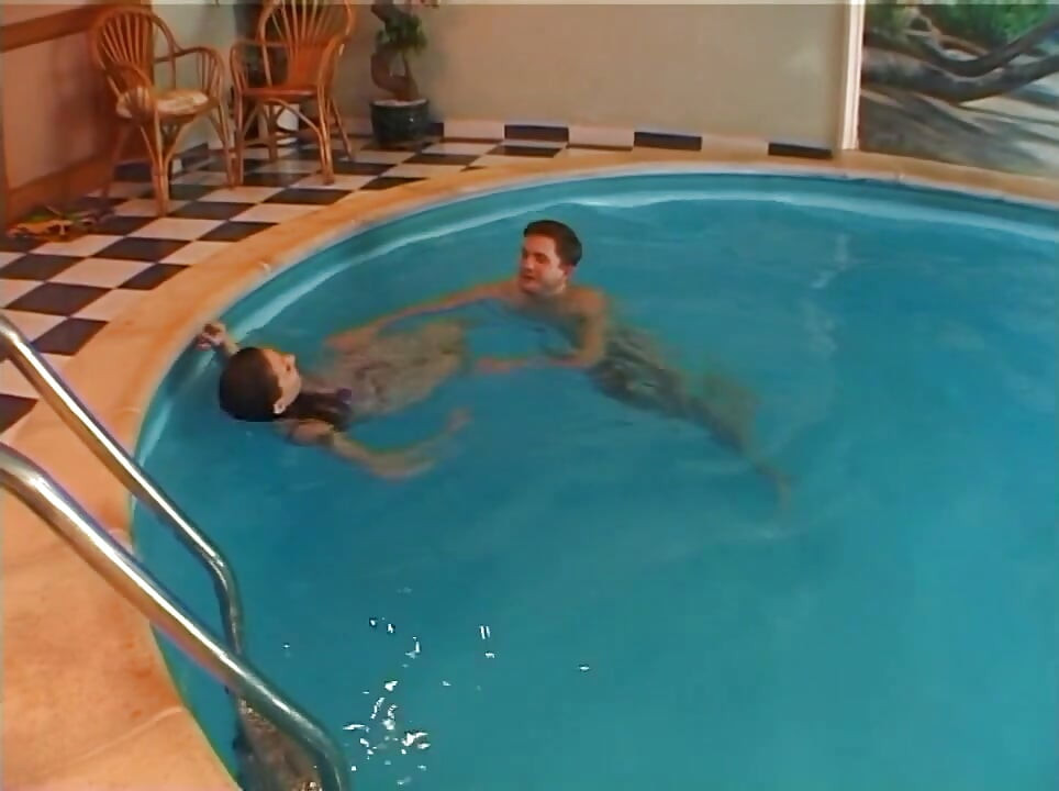 Drilling cute woman next to a swimming pool