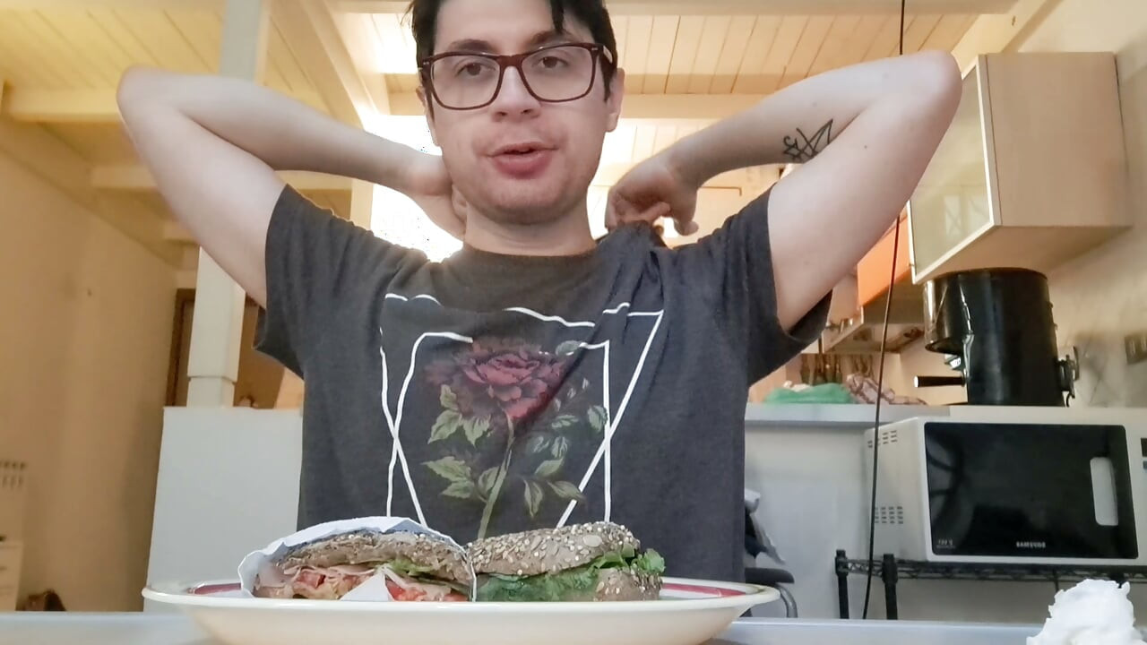 Pig guy eats a sandwich while jerking big cock