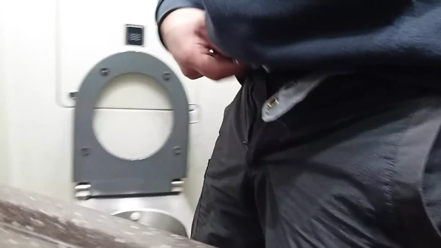 pissing in a public toilet on train