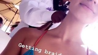 Madison Grace Reed in bikini top, getting her hair braided