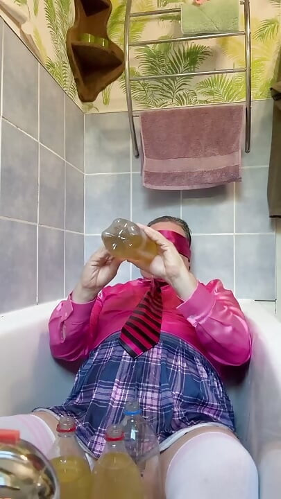 In a schoolgirl outfit to take a piss shower with bottles