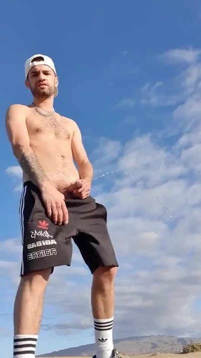 scally lad pissing outdoors