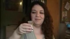 Mature BBW drinks cum from a shot glass