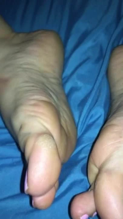 At her feet and pussy play