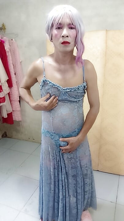Oanh Le shemale eyes sexy dress porn standing with a happy cock leaning on her back
